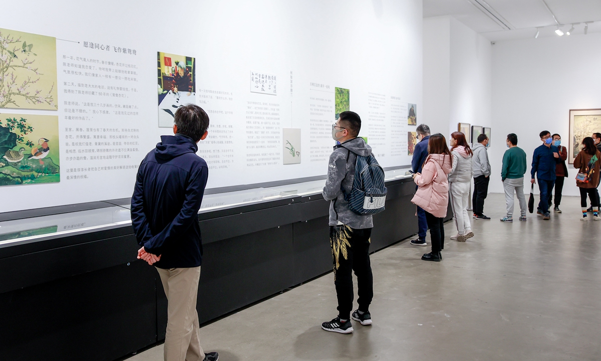 Vistors check the art pieces at the exhibition Photo: Courtesy of Ge Shiheng