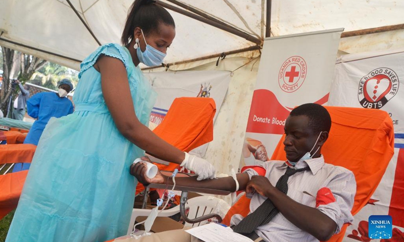 A volunteer donates blood at a blood donation center in Lubaga Cathedral, Kampala, Uganda, Oct. 25, 2021. A blood donation drive was launched in Uganda to ensure sufficient blood supply amidst the COVID-19 pandemic.(Photo: Xinhua)