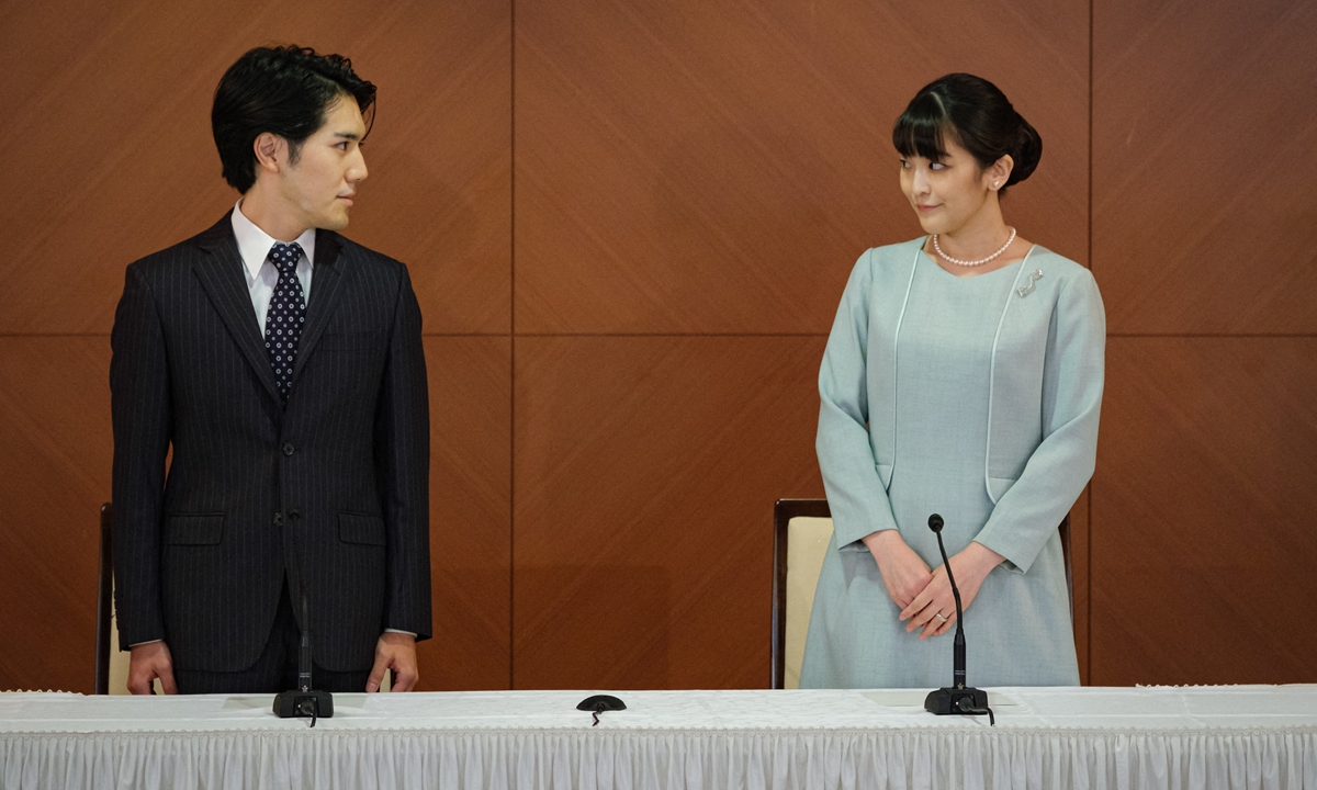 Japan's former princess Mako (right) and her husband Kei Komuro pose during a press conference to announce they have married, at the Grand Arc Hotel in Tokyo on Tuesday. Photo: AFP