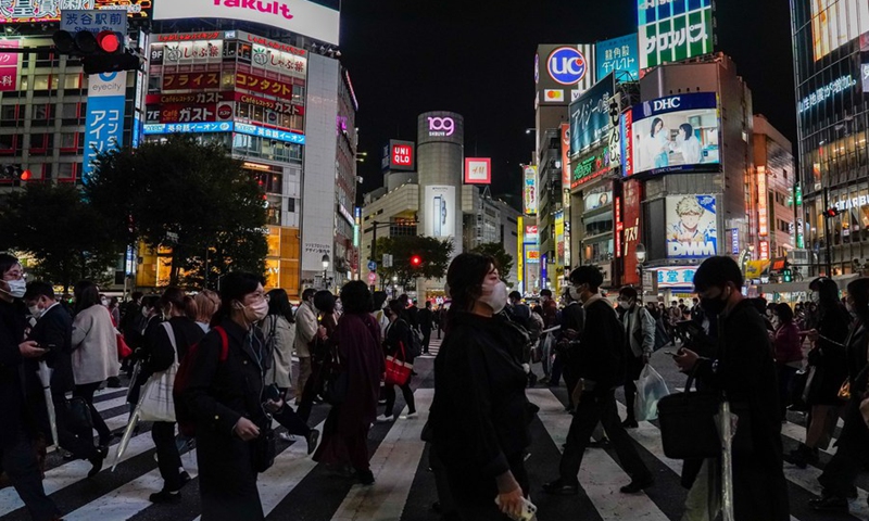 Pedestrians walk across the street at Shibuya in Tokyo, Japan, Oct. 25, 2021.(Photo: Xinhua)