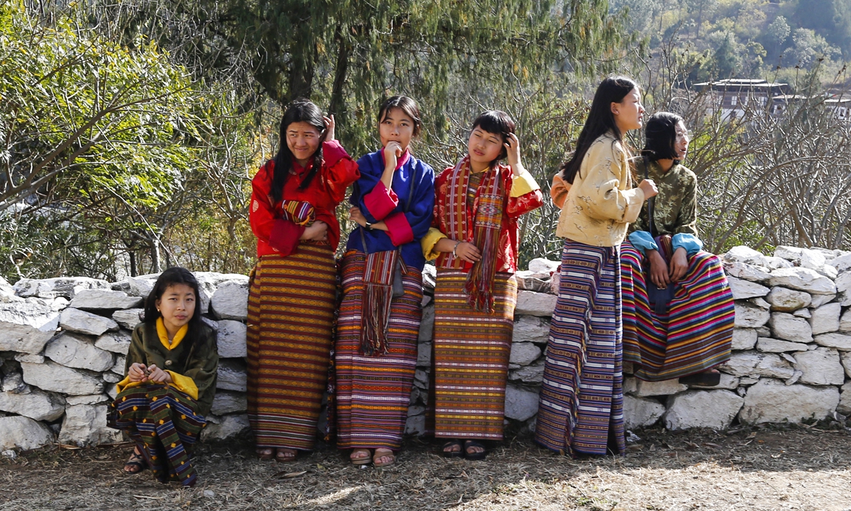 Bhutanese girls chat in Punakha on February 16, 2019. Photo: VCG