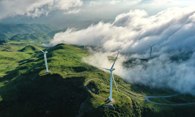 Aerial photo taken on Aug. 19, 2020 shows wind turbines in Jiucaiping scenic spot in southwest China's Guizhou Province.(Photo: Xinhua)