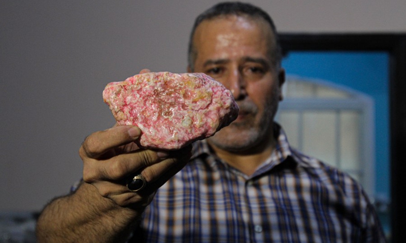Salah al-Kahlout exhibits a rare stone in his center in Jabalia refugee camp in the northern Gaza Strip on October 13, 2021. (Photo: Xinhua)