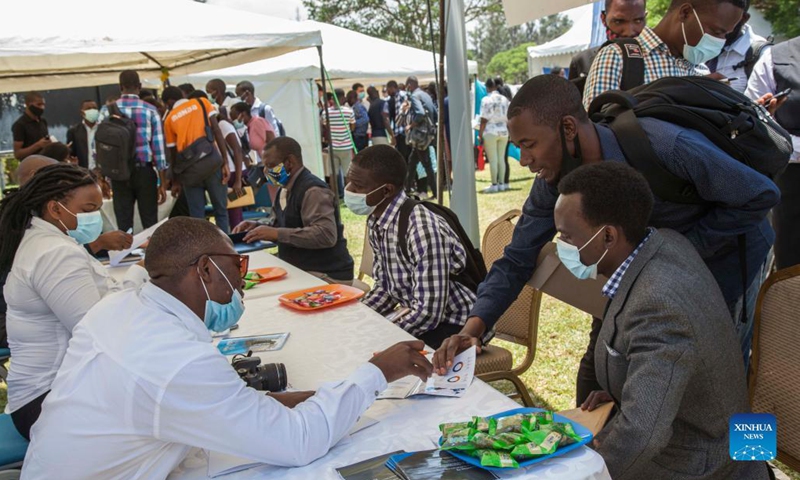 People attend a jobs and career expo at the University of Zambia in Lusaka, Zambia, on Oct. 27, 2021. The Confucius Institute at the University of Zambia (UNZA) on Wednesday held the fourth jobs and career expo where Chinese enterprises based in the southern African nation showcased themselves and tried to lure the local workforce, especially graduating students.(Photo: Xinhua)