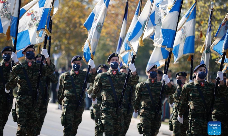 Soldiers march during a military parade in Thessaloniki, northern Greece, on Oct. 28, 2021. Amid COVID-19 restrictions especially in the northern part of the country, Greece celebrated the annual Ochi (No) Day on Thursday with military and student parades.Photo:Xinhua
