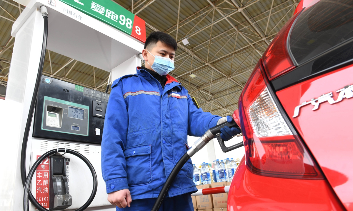 A gas station employee refuels a vehicle in Shijiazhuang, North China's Hebei Province