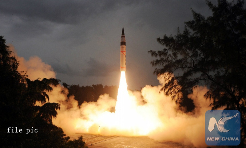 Photo released by India's Defence Research and Development Organization (DRDO) on Sept. 15, 2013 shows India's nuclear-capable missile Agni-V in the Wheeler Island, India.Photo:Xinhua