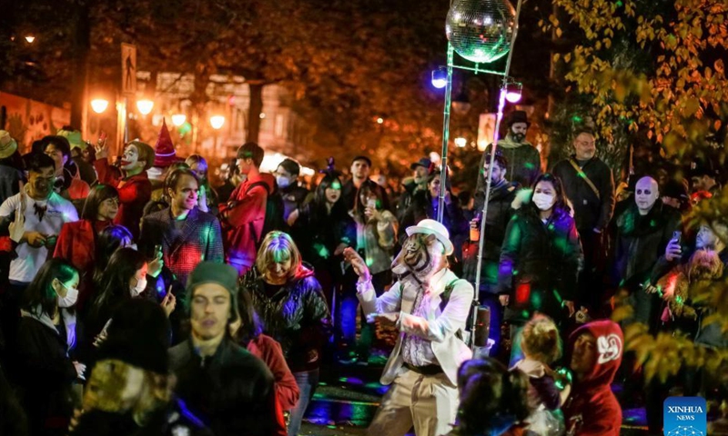 People in costumes march along the street during the Parade of Lost Souls to celebrate the Halloween in Vancouver, British Columbia, Canada, Oct. 30, 2021.  (Photo:Xinhua)