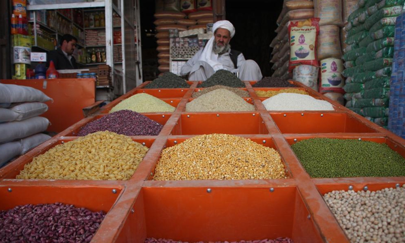 A vendor waits for customers at a market in Kabul, Afghanistan, Oct. 28, 2021.Photo:Xinhua