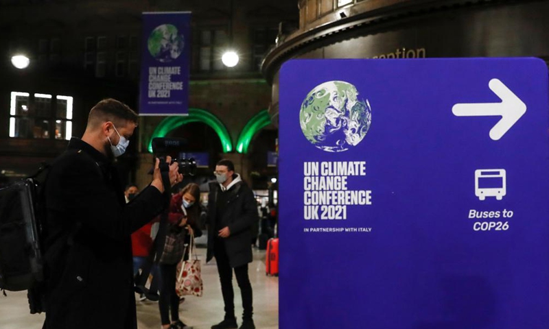 Passengers and police officers are seen at Glasgow Central train station in Glasgow, Scotland, the United Kingdom on Oct. 30, 2021. The 26th United Nations Climate Change Conference of the Parties (COP26) is scheduled from Oct. 31 to Nov. 12 in Glasgow, Scotland. This is the first of its kind since the Paris Agreement came into force.Photo:Xinhua
