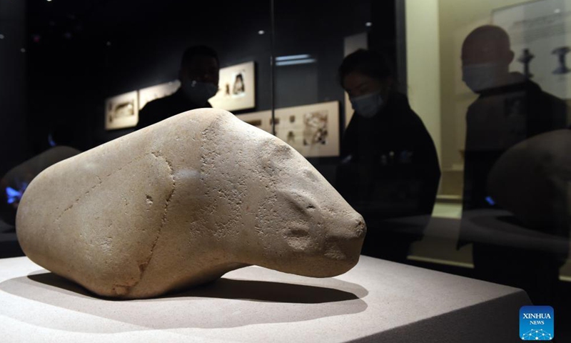 Citizens view a pig-shaped jadeware excavated at Liangjiatan relics site, at Anhui Museum in Hefei, east China's Anhui Province, Oct. 30, 2021.Photo:Xinhua