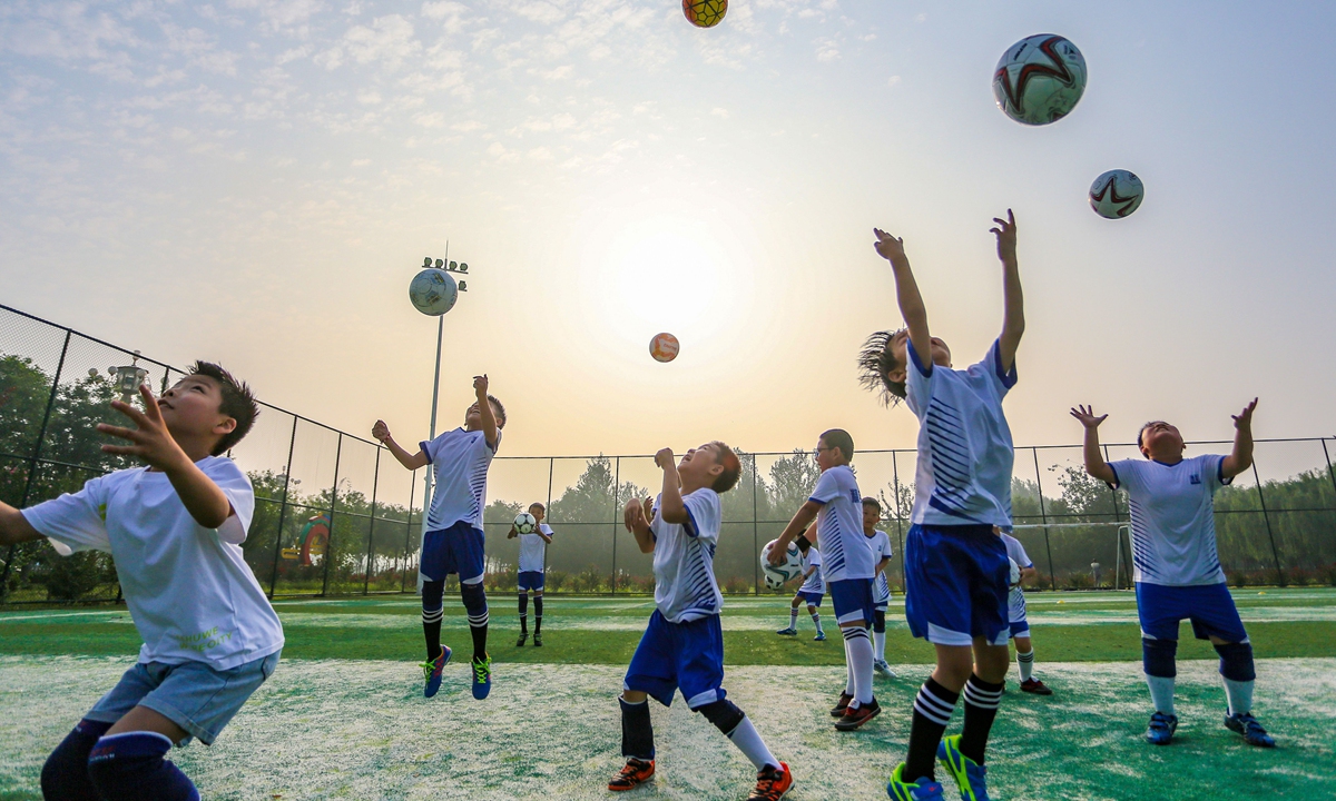 Children receive soccer training at a club in Handan, Hebei Province, on July 31. Photo:VCG
 
