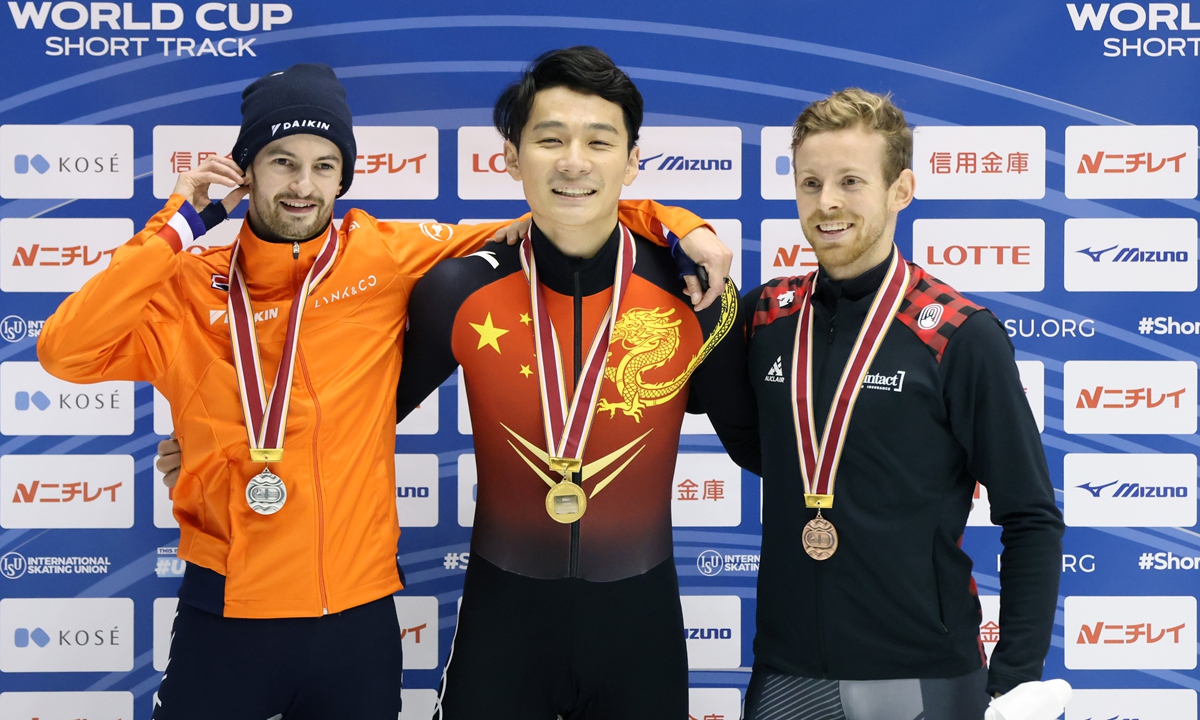 Silver medalist Itzhak de Laat of the Netherlands (Left), gold medalist Ren Ziwei of China (Middle) and bronze medalist Pascal Dion of Canada (Right) poses at the medal ceremony for the Men's 1000m during the ISU World Cup Short Track at Nippon Gaishi Arena on Sunday in Nagoya, Japan. 