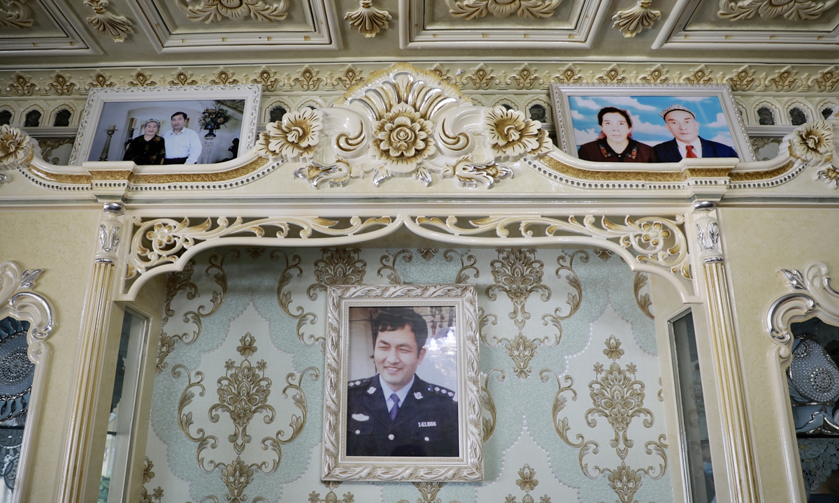 The photo of Mamatjan Tohtiniyaz is hung on the wall of his home. Photo: He Zhuoqian/GT