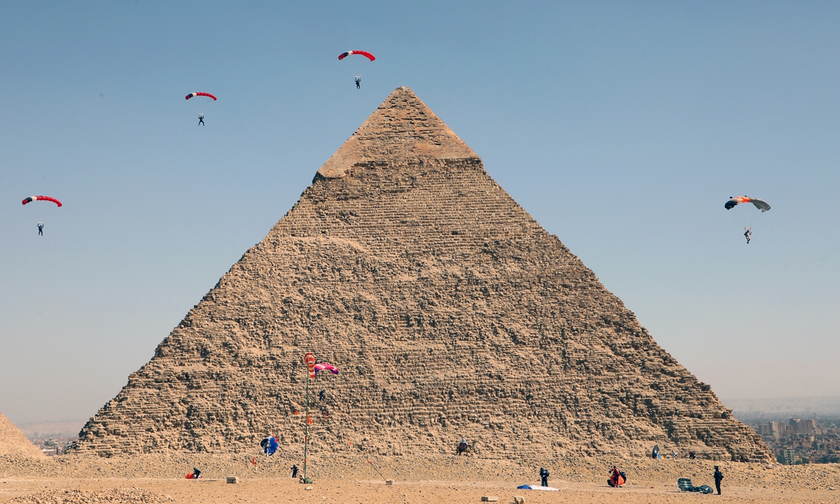 Skydivers fly over the Great Pyramids during the Egypt Air Sports Festival in Giza, Egypt on Monday. Photo: IC