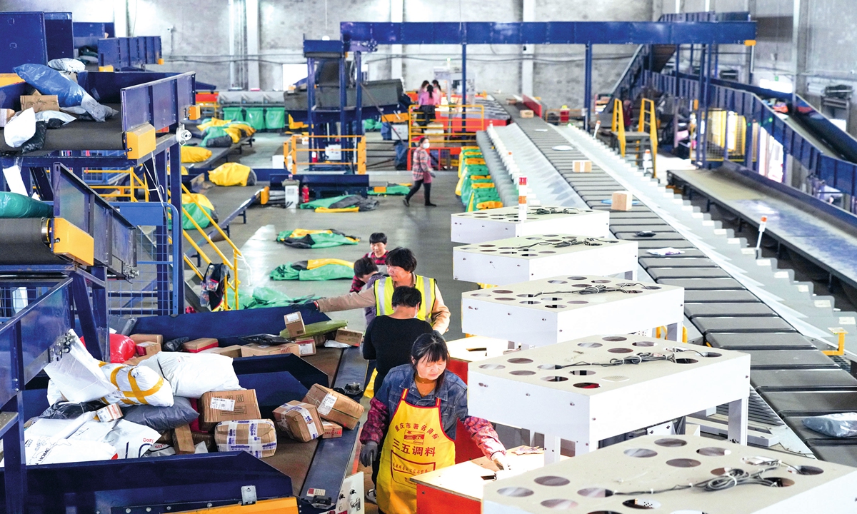 Employees are working at a delivery distribution center in Haian, East China's Jiangsu Province on November 2. Photo: CNS 