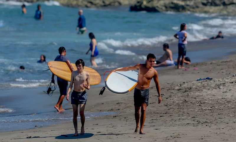 People are seen at a beach in La Union Province, the Philippines, Oct. 30, 2021.(Photo: Xinhua)