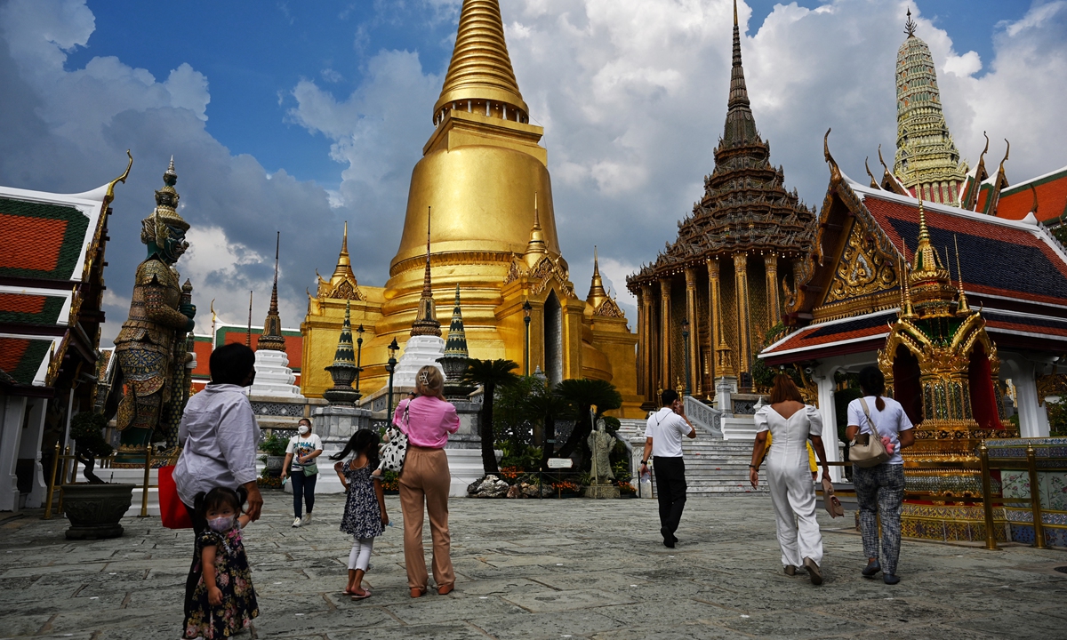 Visitors enter the Grand Palace on the day of reopening in Bangkok on Monday.  Photo: AFP
