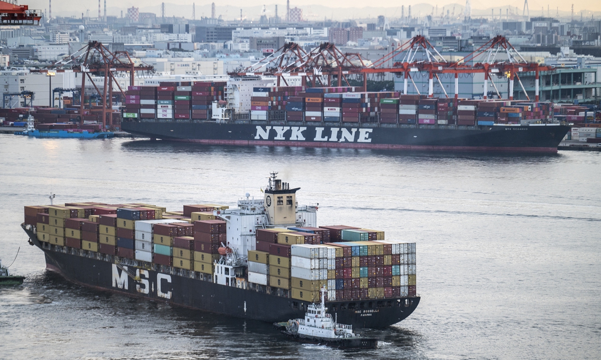 A container ship from MSC (bottom) leaves while another one from NYK Line is docked in the port of Tokyo, Japan on Thursday. Japan's services sector activity grew for the first time in 21 months in October as consumer sentiment picked up after the coronavirus pandemic subsided, Reuters said on Thursday. Photo: AFP