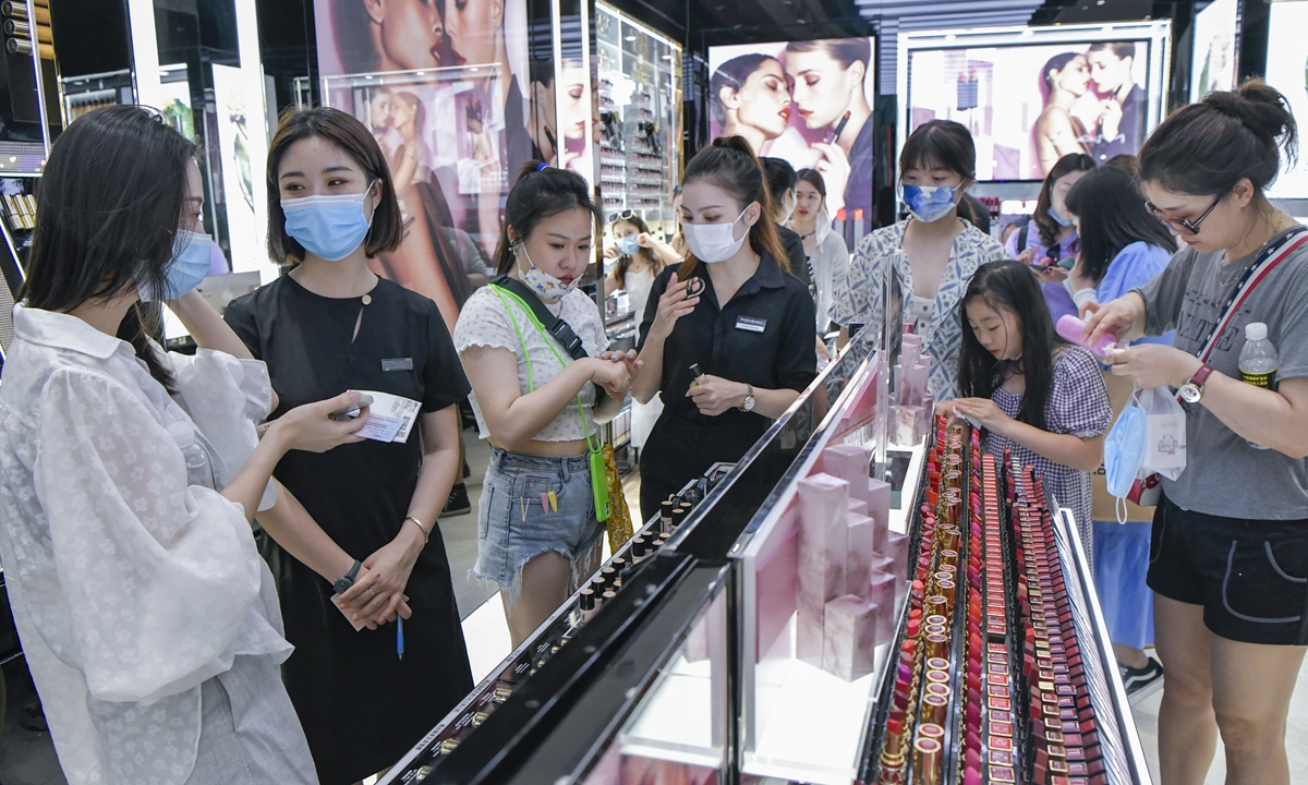 Visitors shop at a duty-free store in Sanya, South China's Hainan Province on May 1, 2021. Duty-free shopping sales in Hainan hit 35.5 billion yuan ($5.55 billion) in the first nine months, up 121 percent year-on-year, as the pandemic disrupted international travel, official data showed on November 4, 2021. Around 5.13 million visits were made to duty-free shops on the island. Photo: cnsphoto