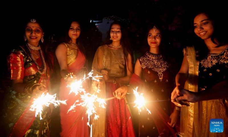 Indian women light oil lamps on the occasion of Diwali, the festival of Lights, in Bhopal, capital of India's Madhya Pradesh, Nov 3, 2021. The festival of Diwali falls on Nov 4.Photo:Xinhua