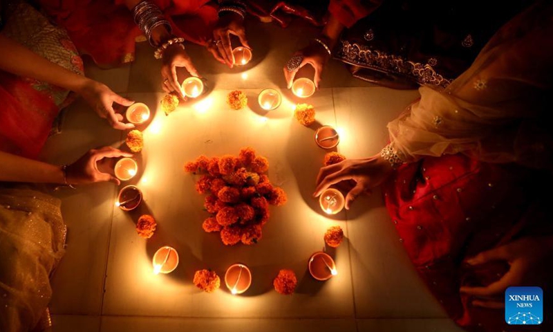 Indian women light oil lamps on the occasion of Diwali, the festival of Lights, in Bhopal, capital of India's Madhya Pradesh, Nov 3, 2021. The festival of Diwali falls on Nov 4.Photo:Xinhua