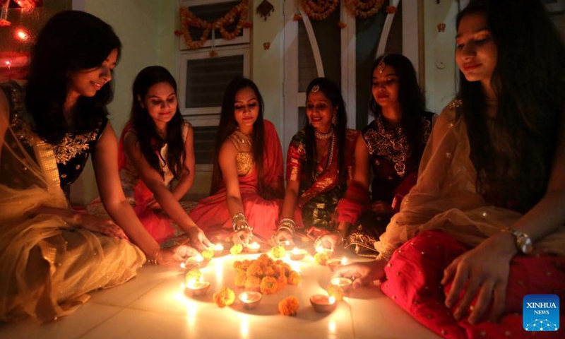 Indian women light oil lamps on the occasion of Diwali, the festival of Lights, in Bhopal, capital of India's Madhya Pradesh, Nov 3, 2021. The festival of Diwali falls on Nov 4.Photo:Xinhua