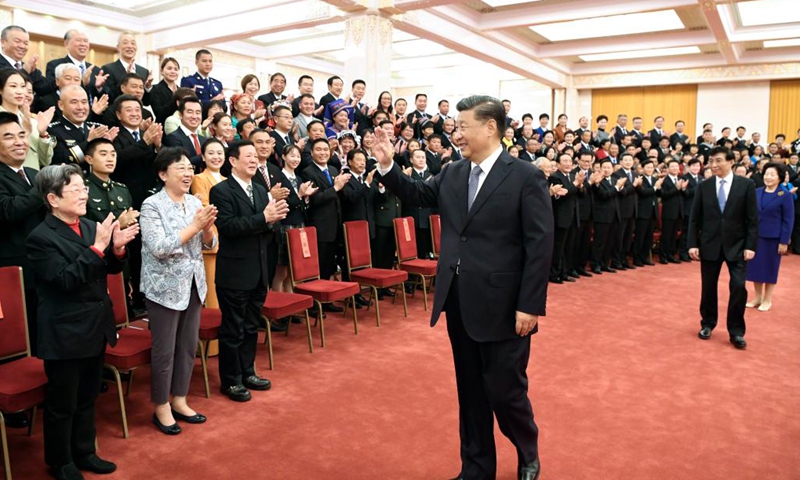 Chinese President Xi Jinping, also general secretary of the Communist Party of China (CPC) Central Committee and chairman of the Central Military Commission, meets with national ethical role models and nomination awards winners at the Great Hall of the People in Beijing, capital of China, Nov. 5, 2021.(Photo; Xinhua)