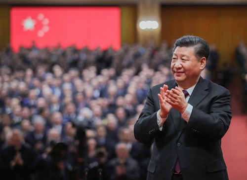Xi Jinping applauds for the personnel awarded with medals during a grand gathering to celebrate the 40th anniversary of China's reform and opening-up at the Great Hall of the People in Beijing, capital of China, Dec. 18, 2018.Photo:Xinhua