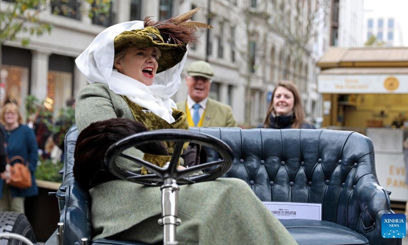 The owner sits in her veteran car during the annual Regent Street Motor Show in London, Britain, Nov. 6, 2021.Photo:Xinhua