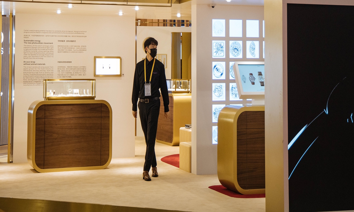 Staff working a luxury brand booth at the 4th China International Import Expo on November 7,2021 
Photo: Li Hao/GT