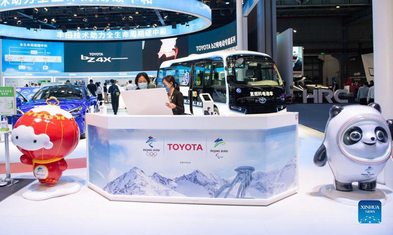 Photo taken on Nov. 7, 2021 shows the mascot of Beijing 2022 Olympic Winter Games Bing Dwen Dwen (R) and the mascot of Beijing 2022 Paralympic Winter Games Shuey Rhon Rhon at the booth of Toyota during the fourth China International Import Expo (CIIE) in east China's Shanghai. (Xinhua/Meng Tao)