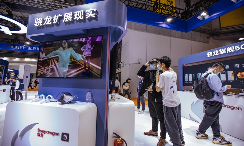 Visitors check out new products in a designated zone for integrated circuits at the 4th China International Import Expo in Shanghai on November 8, 2021. Photo: Li Hao/GT