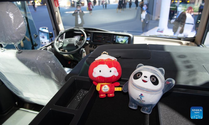 Photo taken on Nov. 7, 2021 shows the mascot of Beijing 2022 Olympic Winter Games Bing Dwen Dwen (R) and the mascot of Beijing 2022 Paralympic Winter Games Shuey Rhon Rhon at the Automobile Exhibition Area during the fourth China International Import Expo (CIIE) in east China's Shanghai. (Xinhua/Meng Tao)