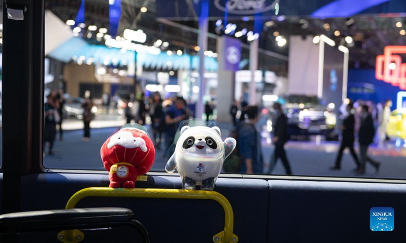 Photo taken on Nov. 7, 2021 shows the mascot of Beijing 2022 Olympic Winter Games Bing Dwen Dwen (R) and the mascot of Beijing 2022 Paralympic Winter Games Shuey Rhon Rhon at the Automobile Exhibition Area during the fourth China International Import Expo (CIIE) in east China's Shanghai. (Xinhua/Meng Tao)