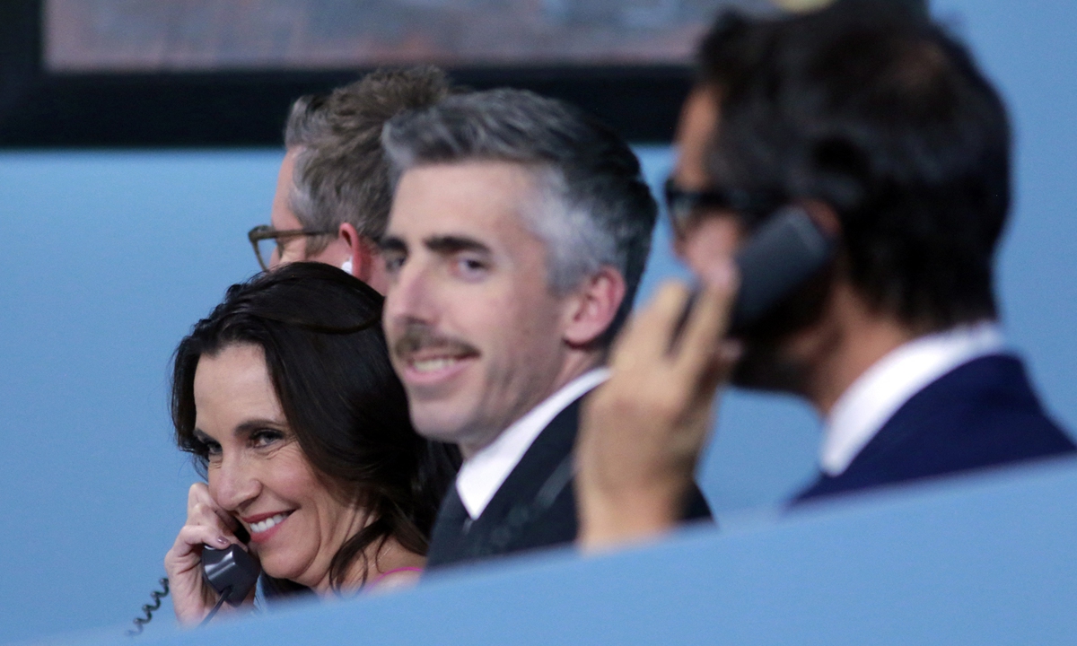 A painting by Pablo Picasso entitled Mousquetaire à la pipe II is displayed at Christie's auction house in New York on October 29. Sotheby's Brooke Lampley (left) and staff take calls for off-site bids during an auction of 11 works by Spanish artist Pablo Picasso from the MGM Resorts Fine Art Collection in Las Vegas on October 23. Photos: AFP 