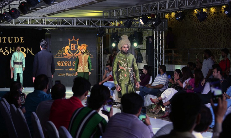 Models present creations during a fashion show in Islamabad, capital of Pakistan on Nov. 8, 2021.(Photo: Xinhua)