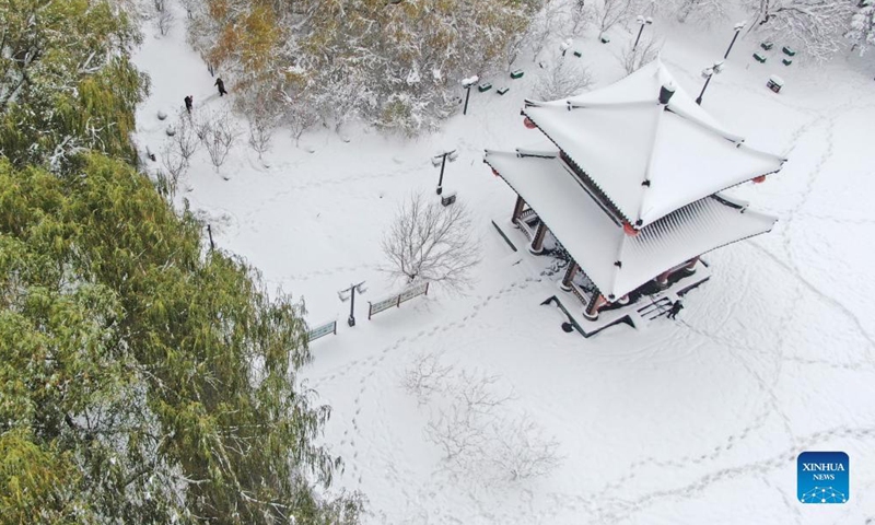 Aerial photo taken on Nov. 9, 2021 shows the snow view of a park in Heping District in Shenyang, northeast China's Liaoning Province. A lingering blizzard since Sunday has brought record snowfall, the biggest since 1905, in Shenyang, the local meteorological authority said Tuesday. As of 8 a.m. Tuesday, the average snowfall in the city reached 51 mm. (Xinhua/Yang Qing)