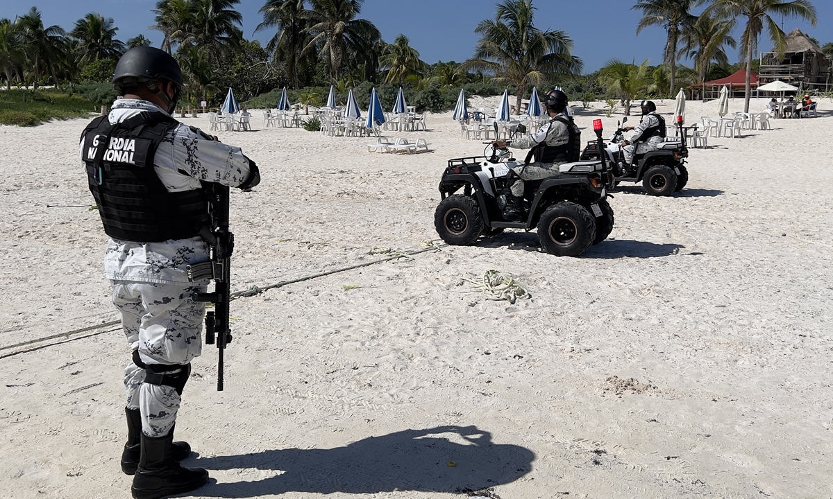 Mexican police officers patrol the Tulum beach on October 30. Photo: AFP