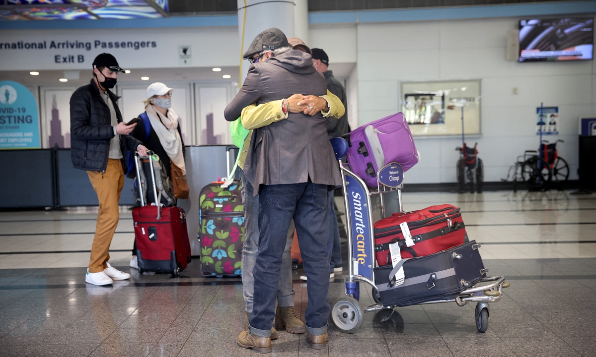Travelers arrive at the international terminal of O'Hare International Airport on Monday in Chicago. Photo: AFP
