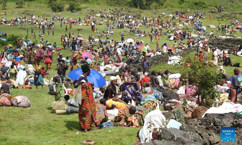 Photo taken on Nov. 8, 2021 shows refugees camping at a playground field at Bunagana in Kisoro, southwestern Uganda. Over 5,000 refugees from the Democratic Republic of Congo (DRC) have crossed to neighboring Uganda through the southwestern district of Kisoro after fresh fighting erupted at home.(Photo: Xinhua)