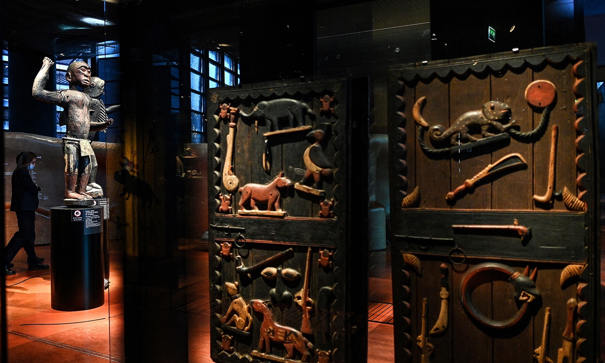 Palace doors and statues of the royal treasures of the Abomey Kingdom on display 
at the Musee du quai Branly in Paris, part of 26 artworks set to be restituted to Benin on Wednesday 
Photo: AFP