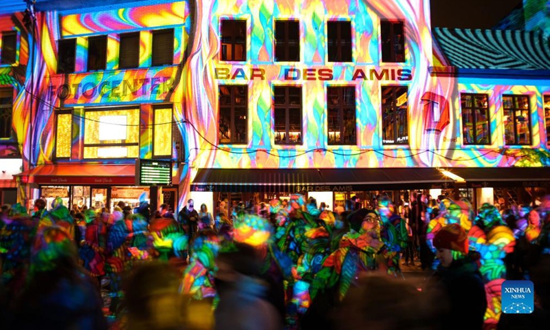 People visit the Ghent Light Festival 2021 in Ghent, Belgium, Nov 11, 2021. From Nov. 10 to 14, over 30 works by international light artists are offered to the public at the Ghent Light Festival 2021, which is held every three years.Photo:Xinhua
