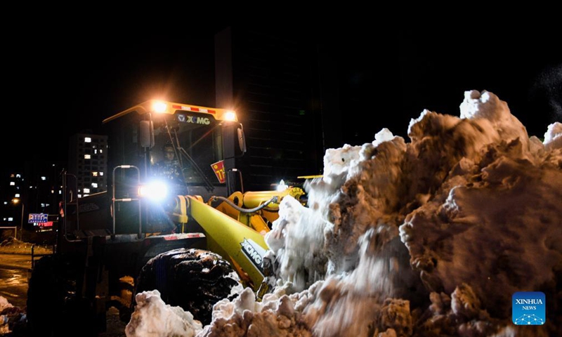 A vehicle shovels snow from the road in Tongliao, north China's Inner Mongolia Autonomous Region, Nov. 11, 2021. In response to the record blizzard, Tongliao government has carried out snow removing operations round-the-clock to resume local transportation.Photo:Xinhua