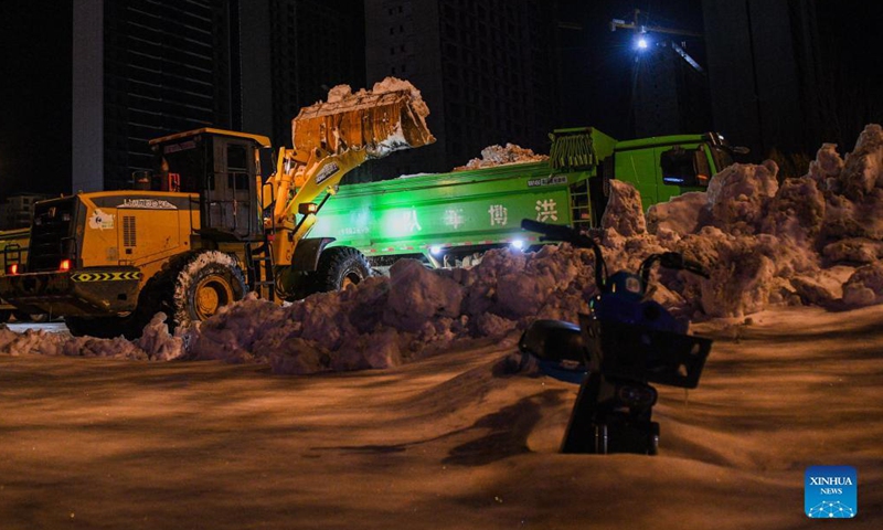 A vehicle shovels snow from the road in Tongliao, north China's Inner Mongolia Autonomous Region, Nov. 11, 2021. In response to the record blizzard, Tongliao government has carried out snow removing operations round-the-clock to resume local transportation.Photo:Xinhua
