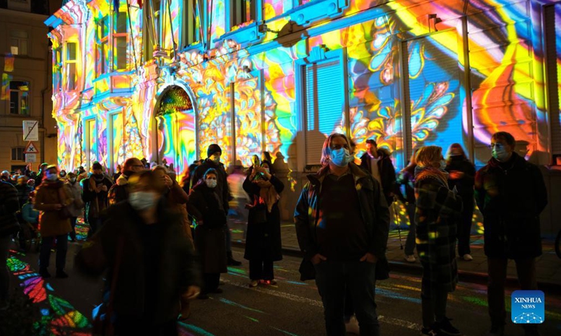 People visit the Ghent Light Festival 2021 in Ghent, Belgium, Nov 11, 2021. From Nov. 10 to 14, over 30 works by international light artists are offered to the public at the Ghent Light Festival 2021, which is held every three years.Photo:Xinhua