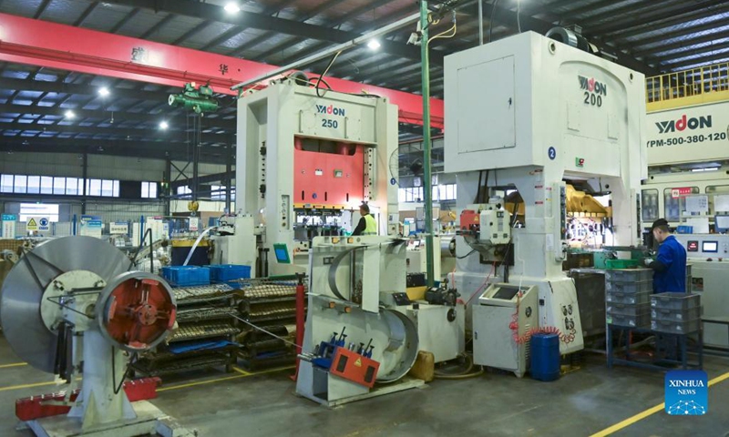 An empolyee works on an auto parts production line in Chuzhou, east China's Anhui Province, Nov. 6, 2021. Chuzhou has been actively supporting the restructuring and upgrading of the city's auto parts sector, one of its pillar industries. Photo: Xinhua