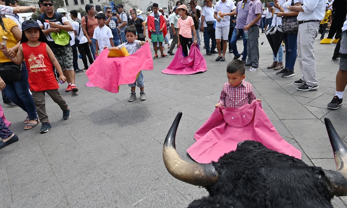 Supporters of bullfights and cockfights rally in Lima, Peru on February 21. Photos: AFP