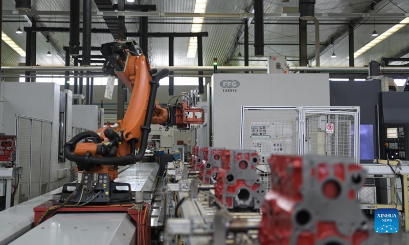 Robotic arms are seen at work on an auto parts production line in Chuzhou, east China's Anhui Province, Nov. 7, 2021. Chuzhou has been actively supporting the restructuring and upgrading of the city's auto parts sector, one of its pillar industries. Photo: Xinhua
