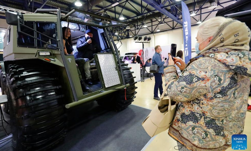 People take photos during a travel vehicles exhibition in Moscow, Russia, Nov. 14, 2021.Photo:Xinhua